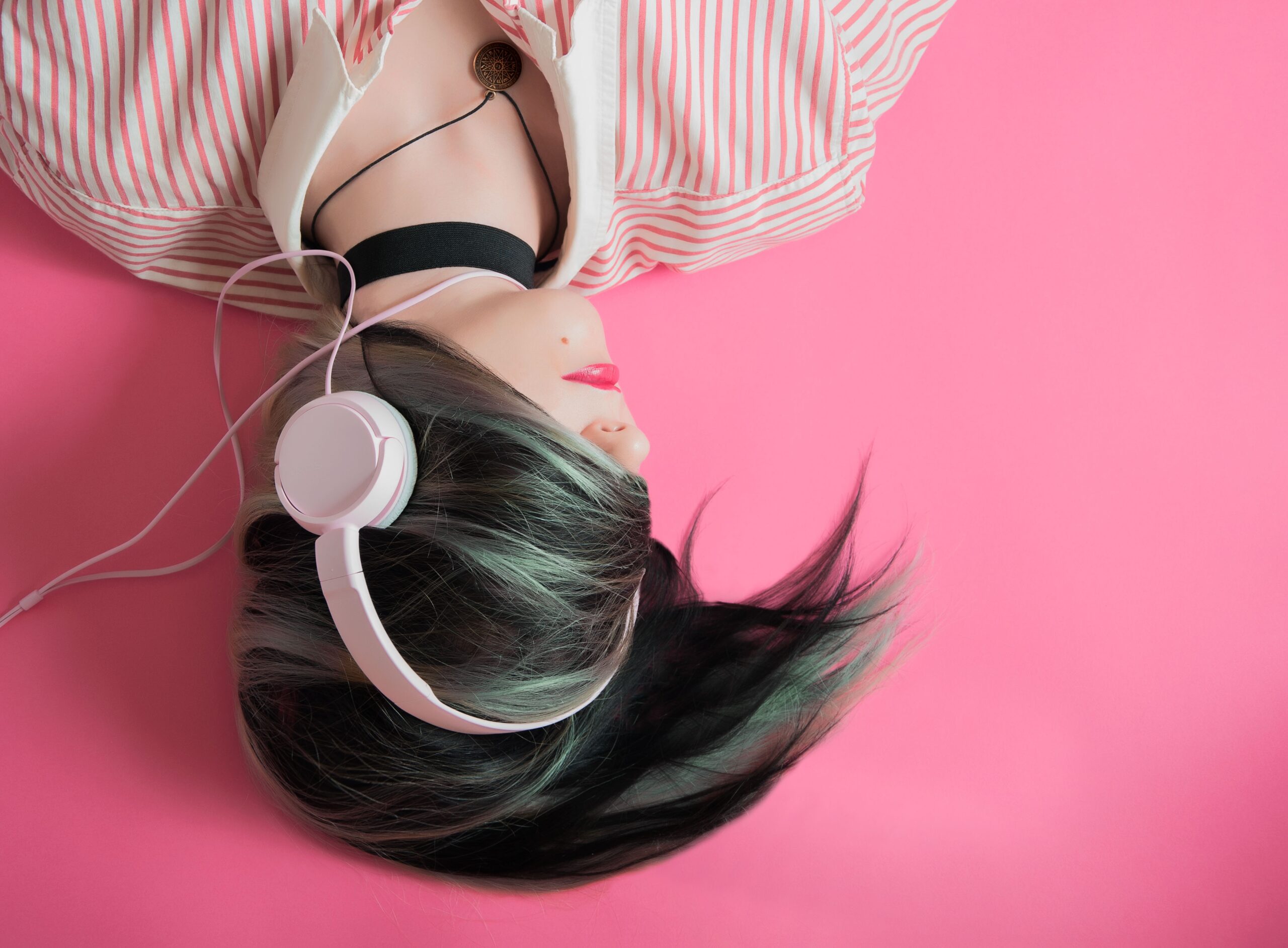 girl lying down with hair swept over her face for Social Media photography